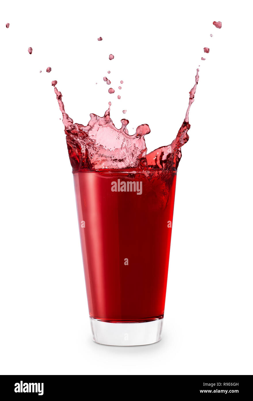 red juice or berry compote with splashes in glass isolated on white