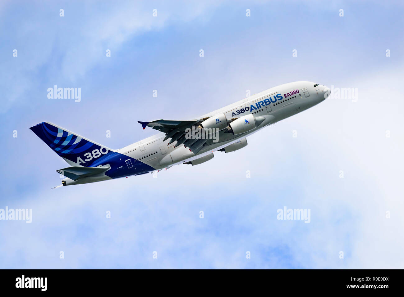 Airbus A380 airliner climbs away after take-off, giving a side view and showing the windows of the two passenger decks. Stock Photo