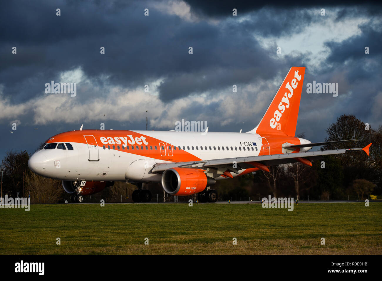 easyjet Airbus A319 jet airliner plane at London Southend Airport, Essex, UK under heavy sky. Bad weather. Black clouds Stock Photo