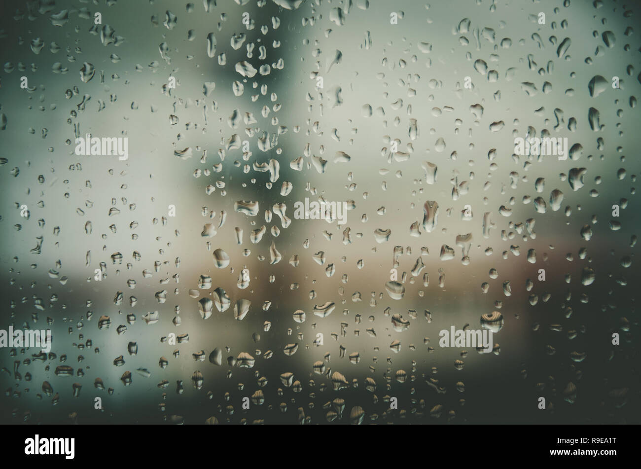Wallpaper of rain drops or water drops on the glass, Vintage background by  rainy drop on window, Rainy day with raindrop on the glass, Texture of wate  Stock Photo - Alamy