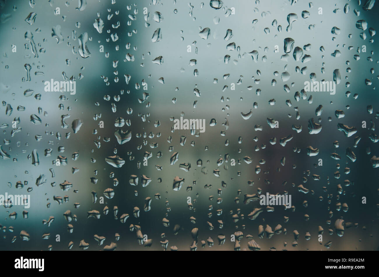 Wallpaper of rain drops or water drops on the glass, Vintage background by  rainy drop on window, Rainy day with raindrop on the glass, Texture of wate  Stock Photo - Alamy