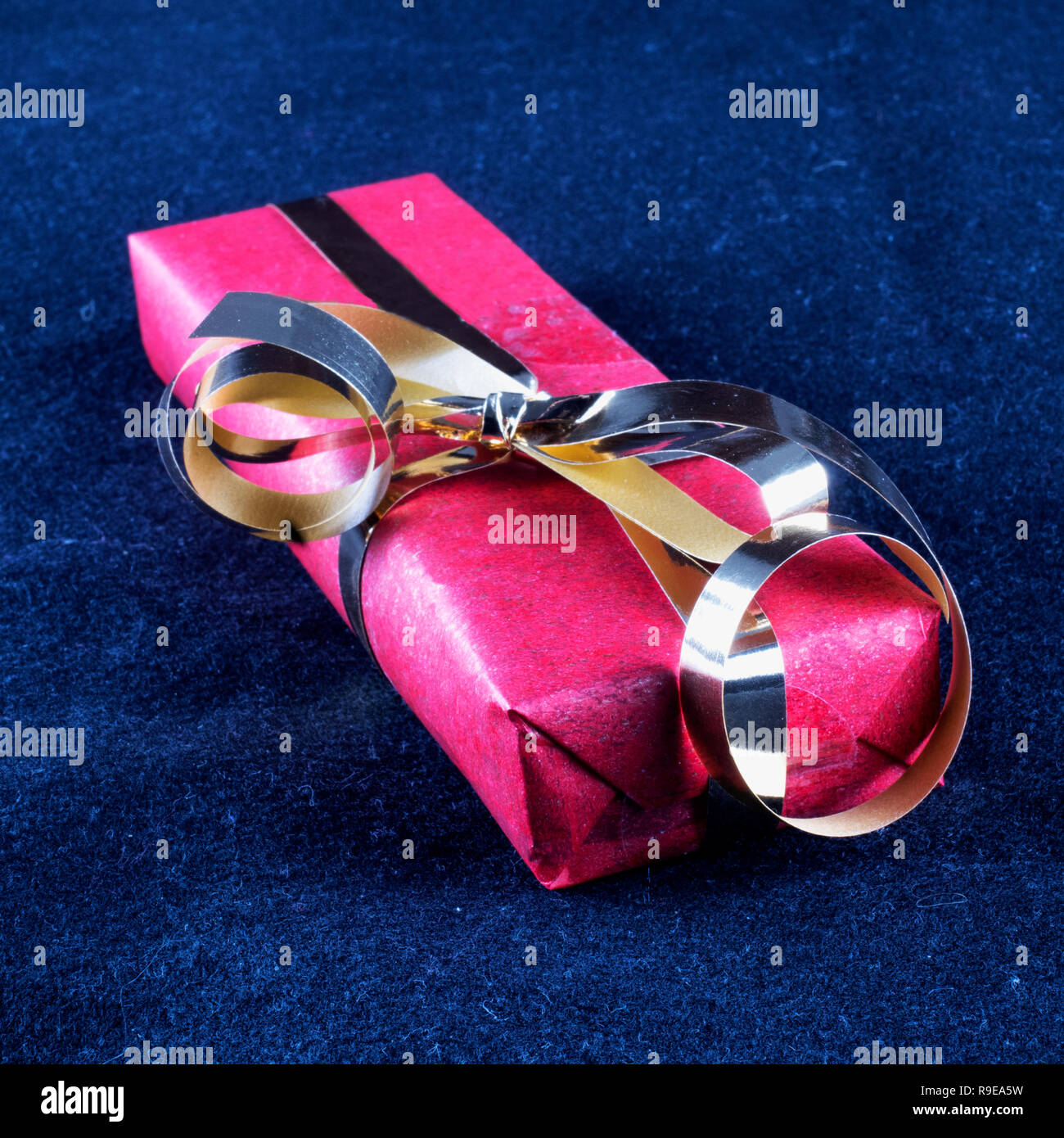 Gift box over black background, square image Stock Photo