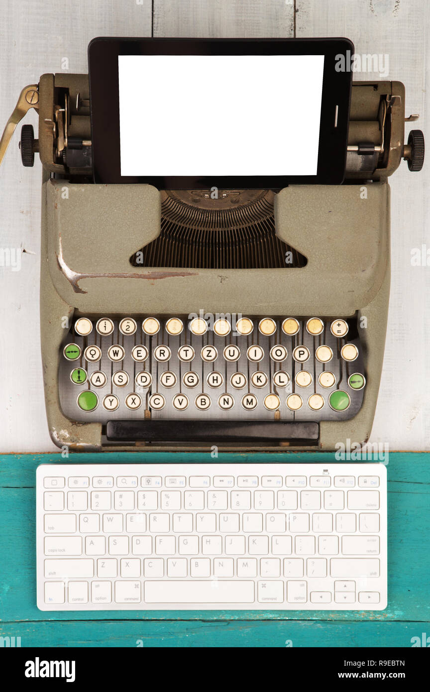 Concept of technology progress old typewriter and new computer