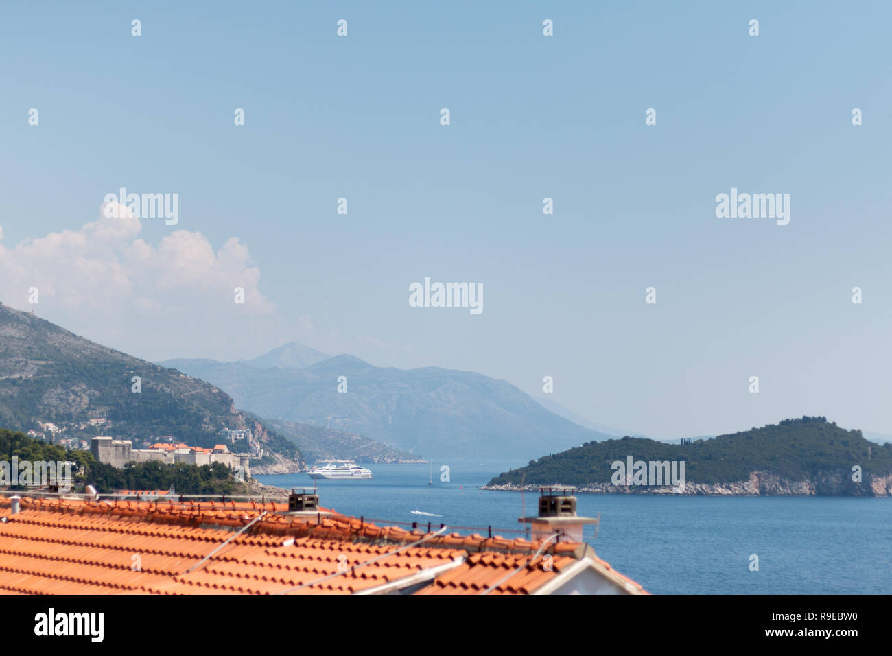 view across the rooftops to Lokrum Island, off mainland Dubrovnik ...