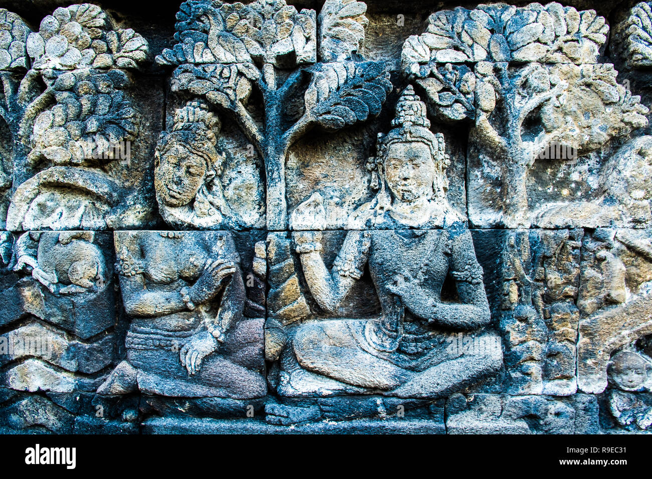 Beautiful ancient wall art relief with Buddha, Buddhist temple complex