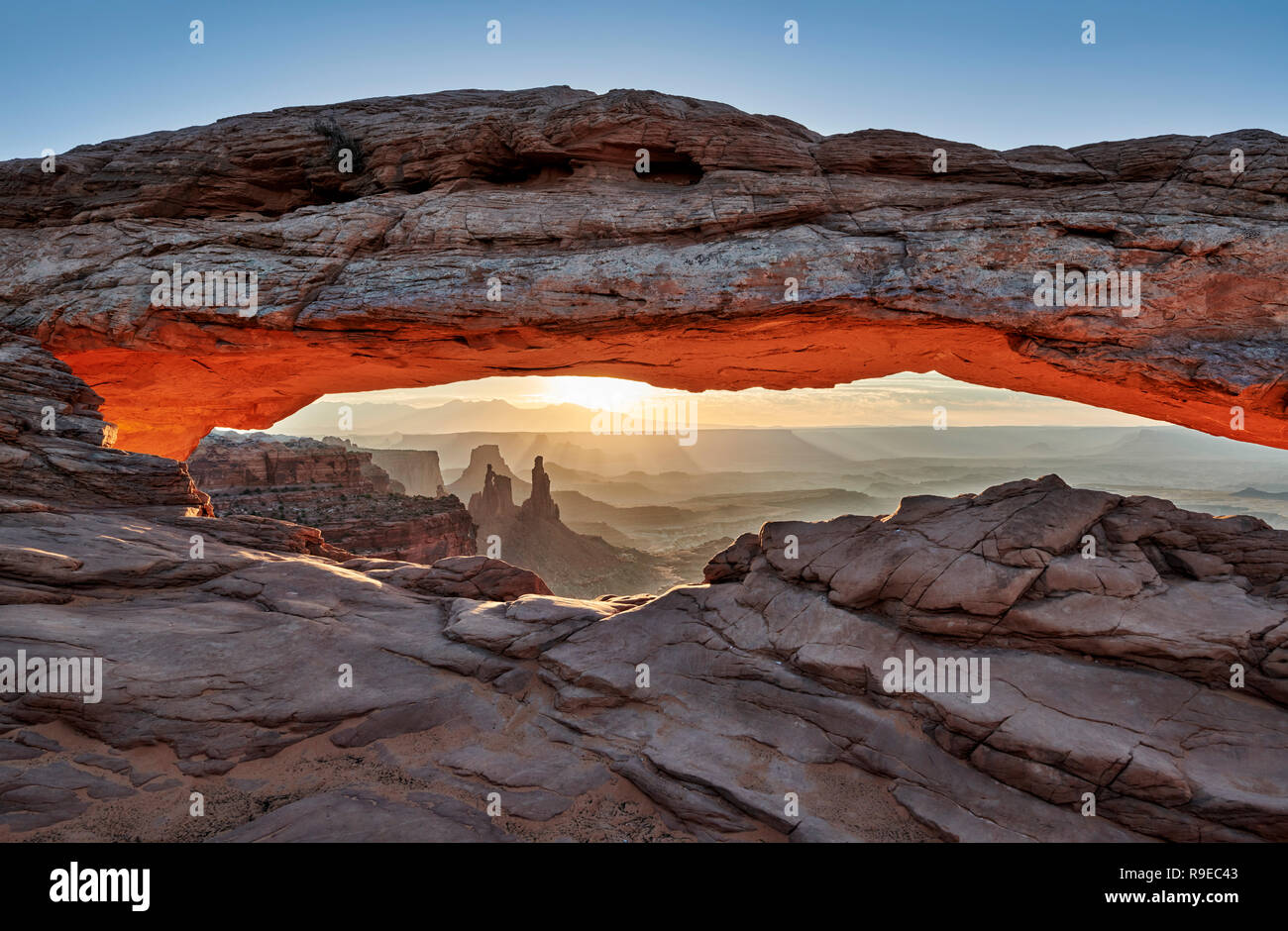 sunrise behind Mesa Arch in Canyonlands National Park, Island in the Sky, Moab, Utah, USA, North America Stock Photo