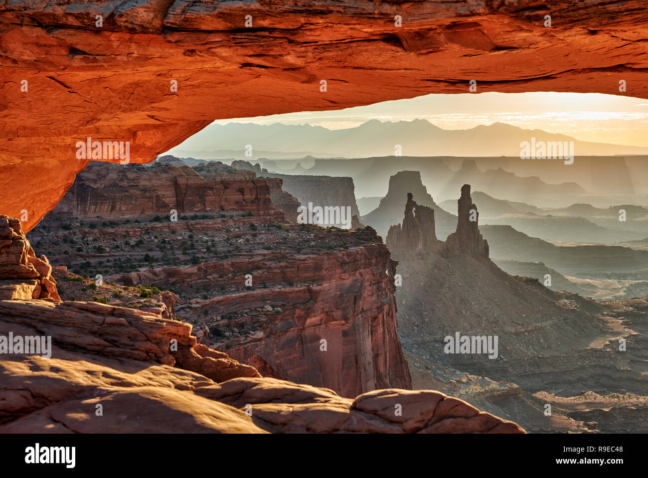 sunrise behind Mesa Arch in Canyonlands National Park, Island in the Sky, Moab, Utah, USA, North America Stock Photo