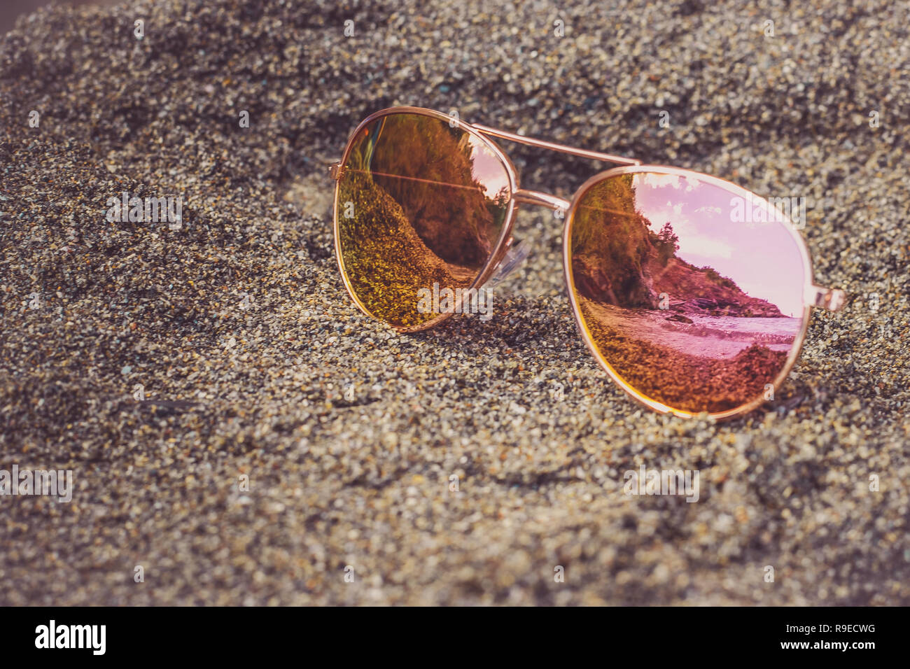 Sunglasses at the beach with sea reflection Stock Photo Alamy