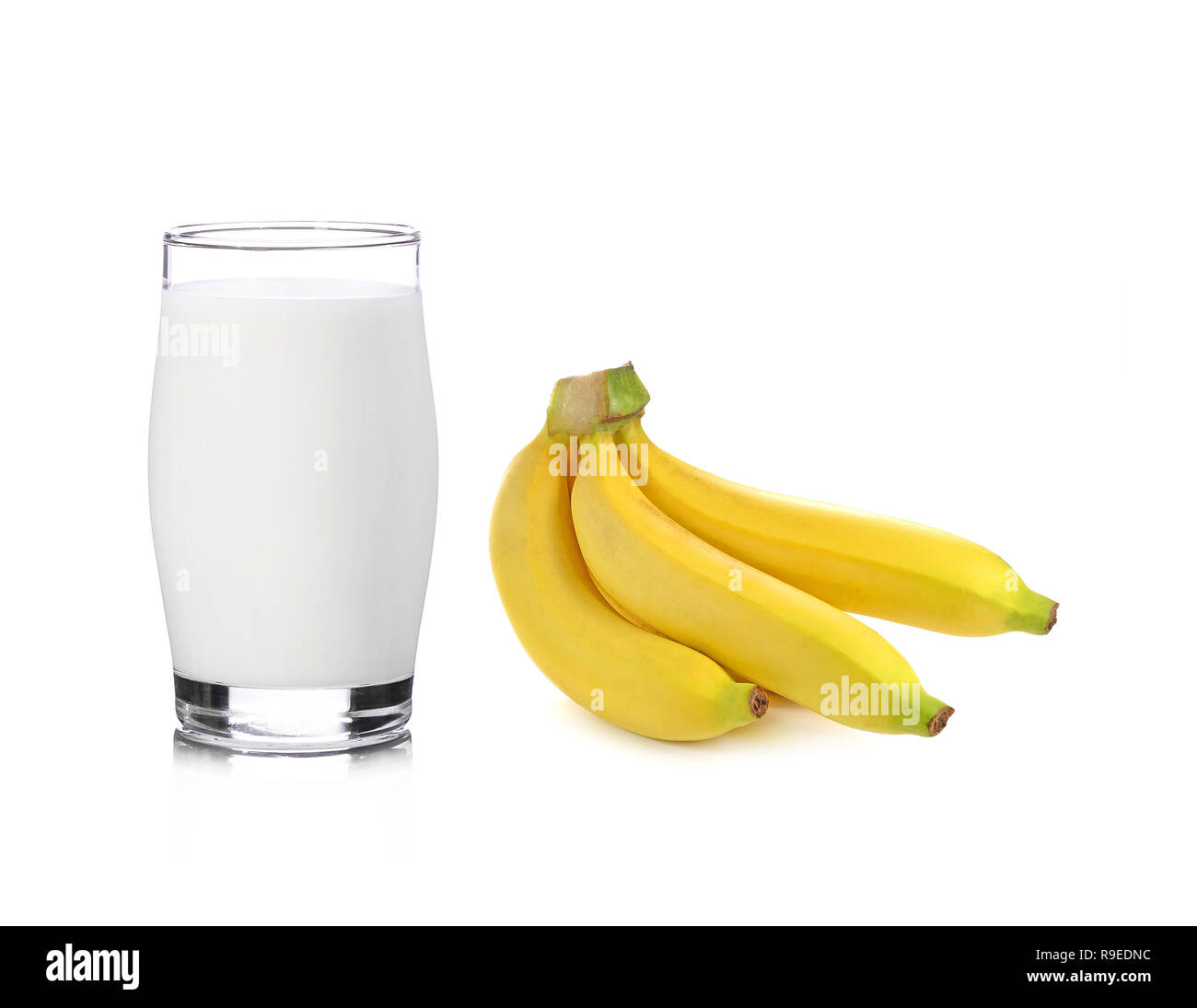Glass of milk with banana over white background Stock Photo - Alamy