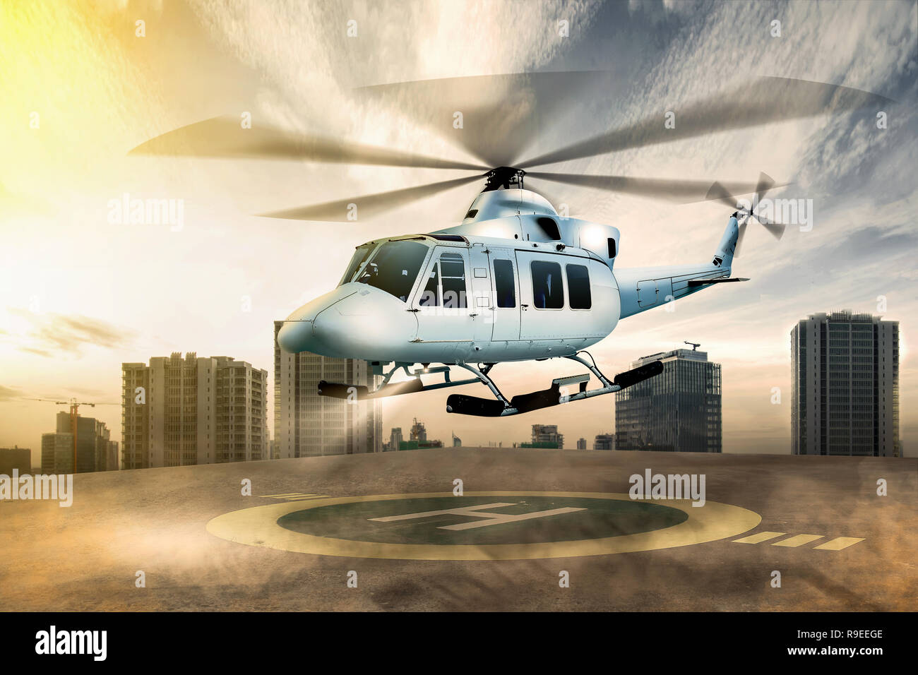 White helicopter landing on helipad at building rooftop with cityscapes