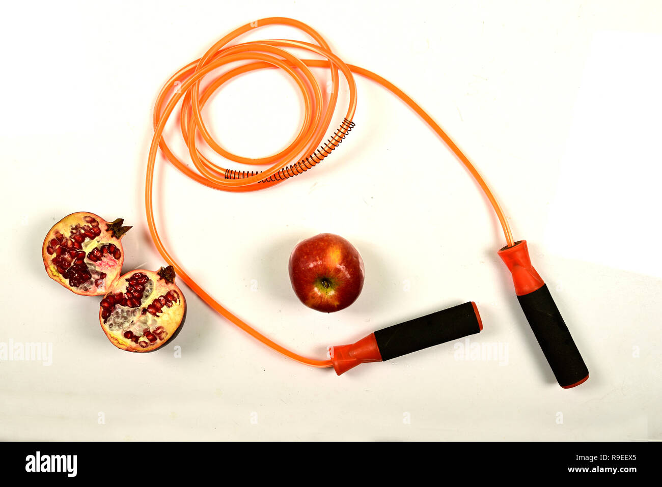 jumping rope and fruit isolated on white background. Stock Photo