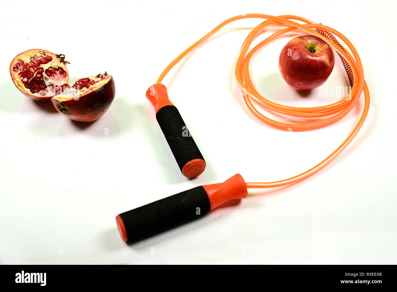 jumping rope and fruit isolated on white background. Stock Photo