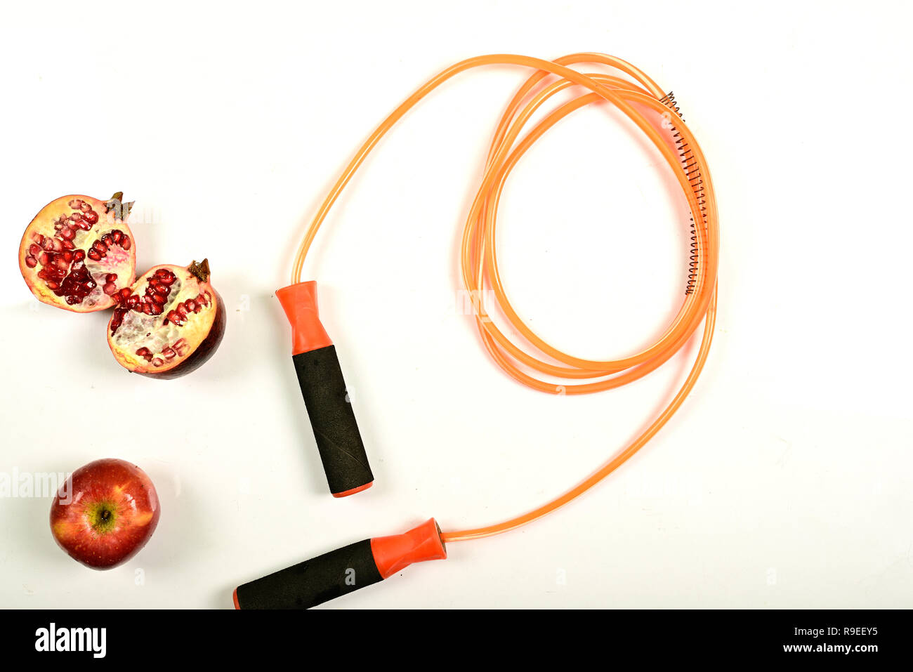 jumping rope and fruit isolated on white background. Stock Photo