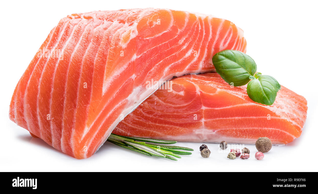 Fresh raw salmon fillets with herbs and spices on white background ...
