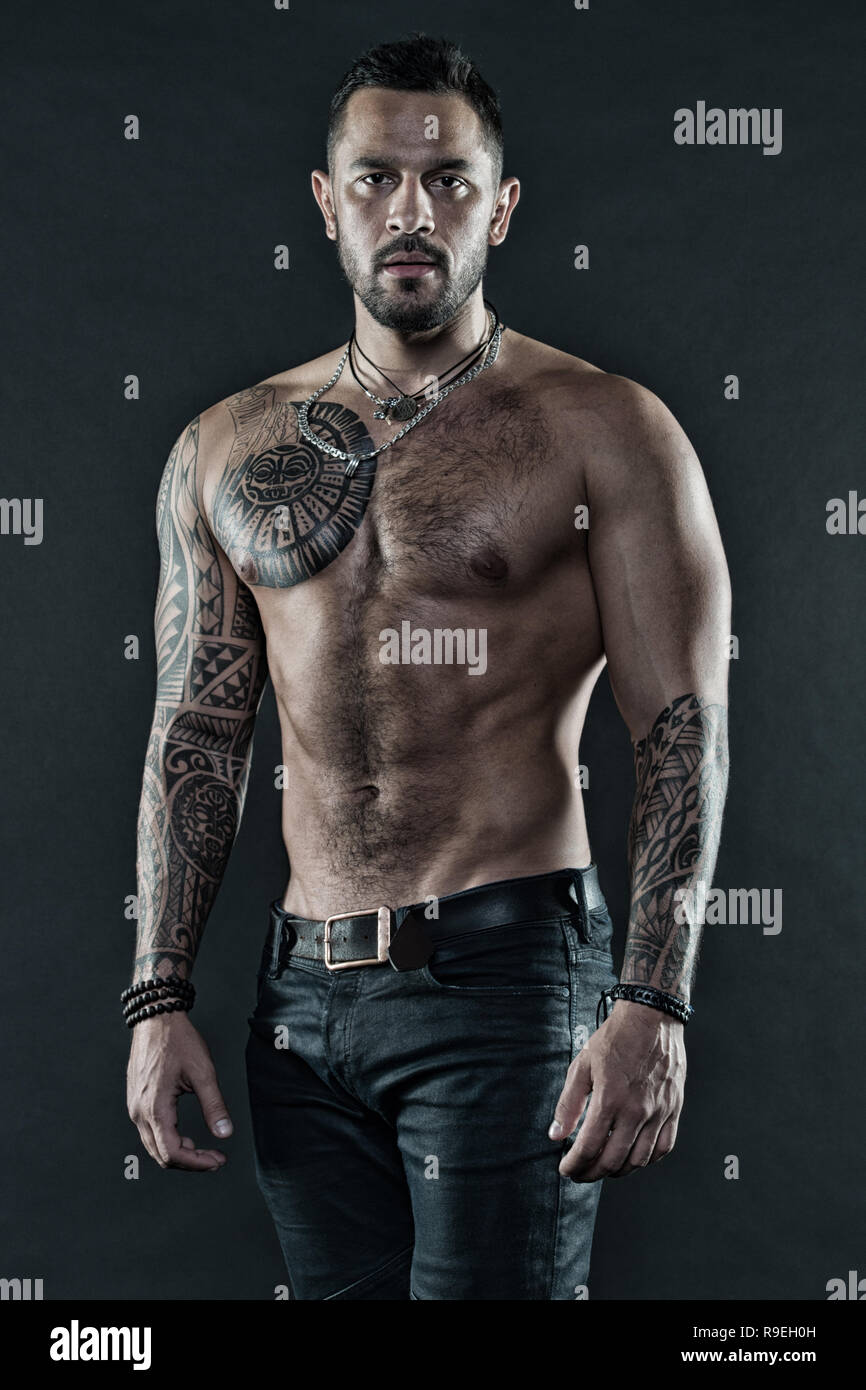 Masculinity and brutality. Tattoo culture concept. Tattoo brutal attribute. Man brutal unshaven hispanic appearance tattooed arms. Bearded man show tattooed torso. Brutal strict macho with tattoos Stock Photo - Alamy Masculinity and brutality. Tattoo culture concept. Tattoo brutal attribute. Man brutal unshaven hispanic appearance tattooed arms. Bearded man show tattooed torso. Brutal strict macho with tattoos Stock Photo - Alamy