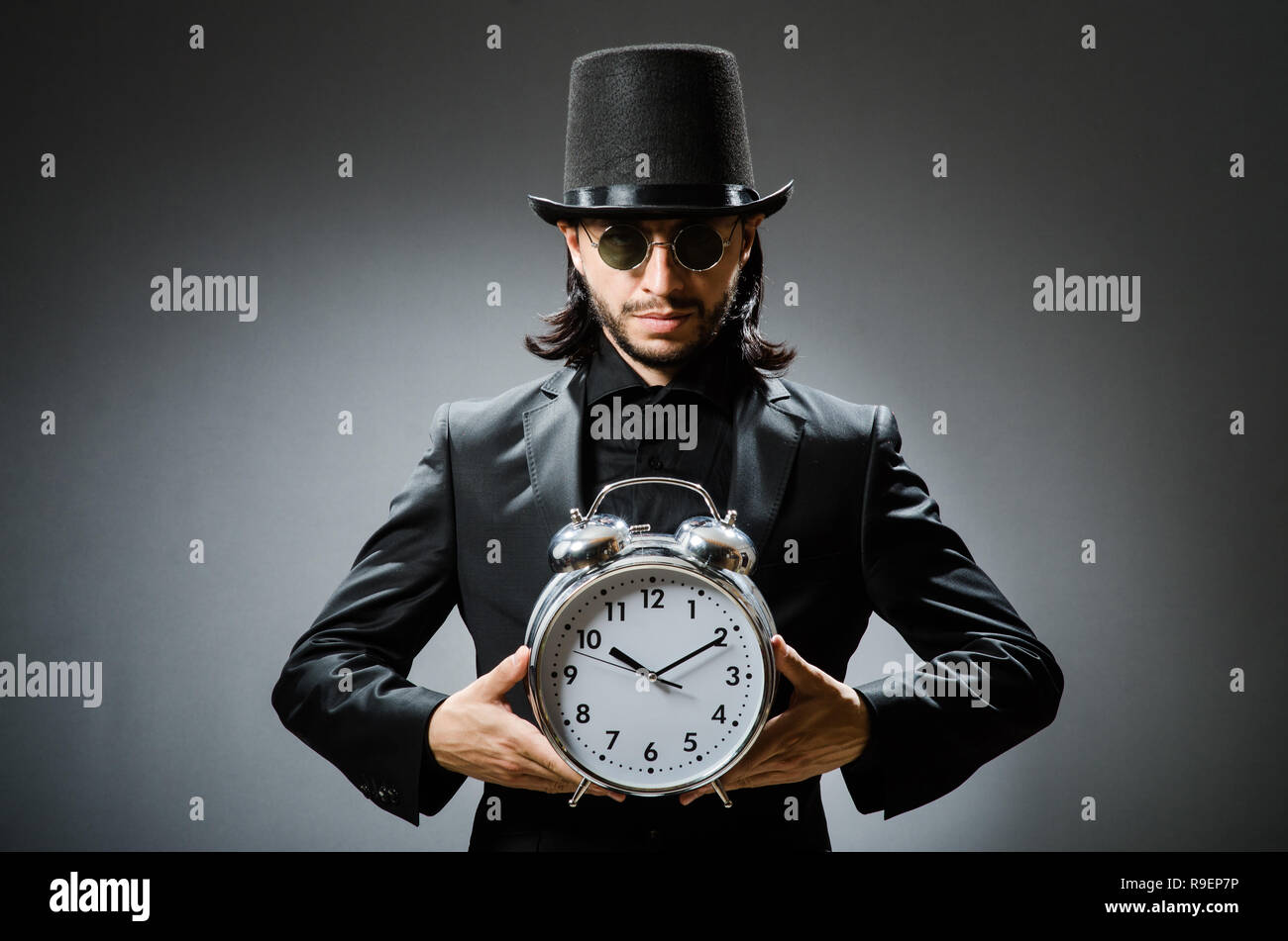 Vintage concept with man wearing black top hat Stock Photo - Alamy