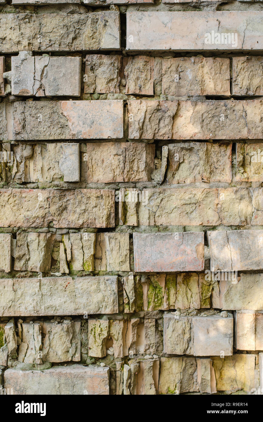 Details of textured aged brick wall. Can be used as background. Vertikal. Close-up. Stock Photo