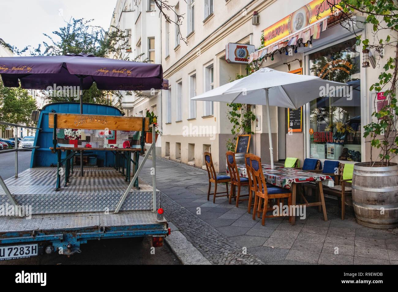 Berlin Mitte. happy Buddha Indian restaurant with outdoor tables extra seating on a parked truck Stock Photo Alamy