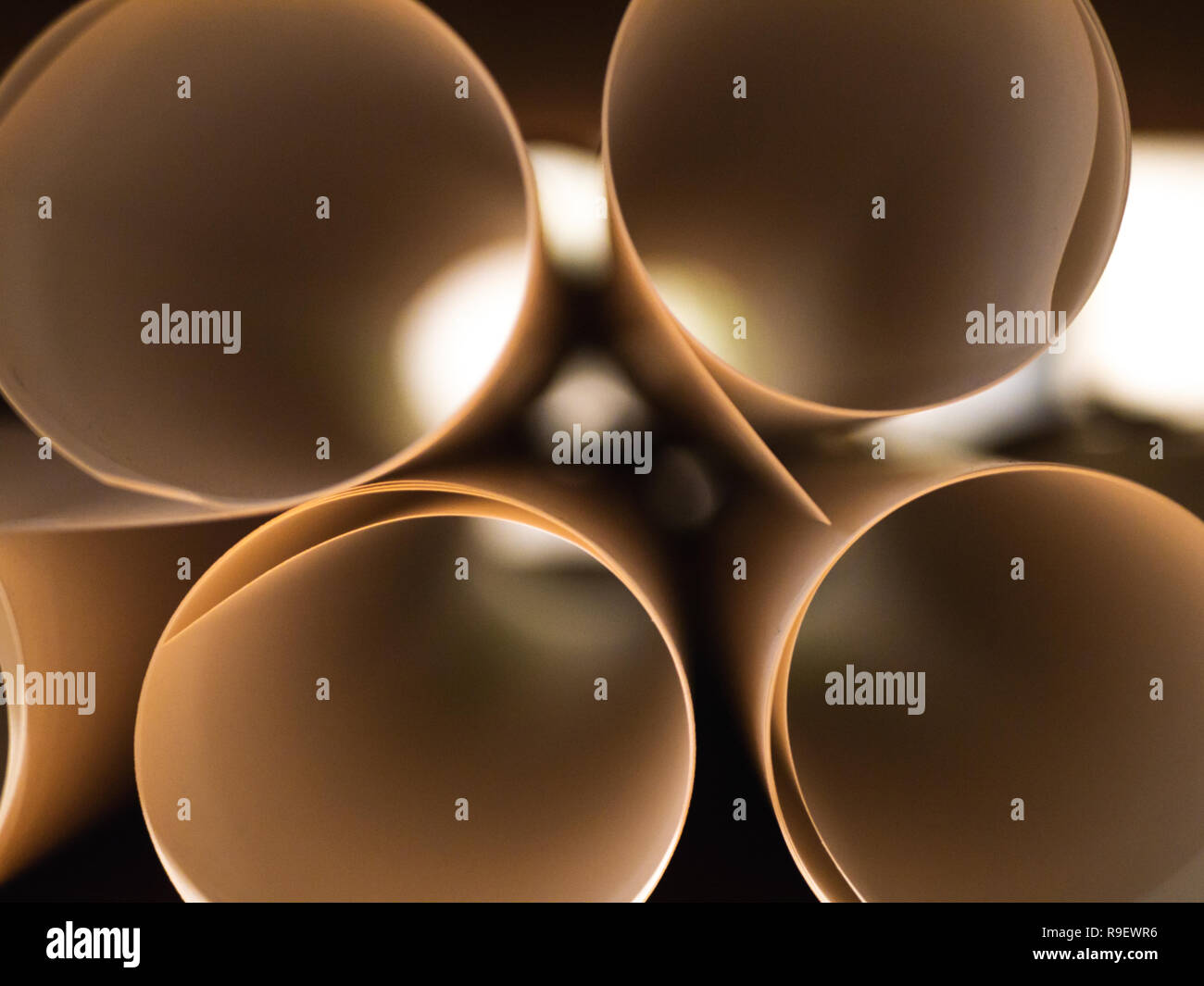 close-up: Looking into white paper rools Stock Photo