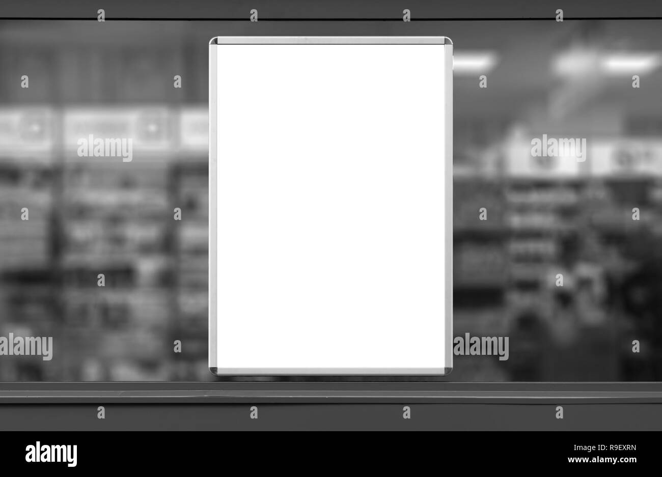 Empty advertising board in drugstore showcase. Blurry background Stock Photo