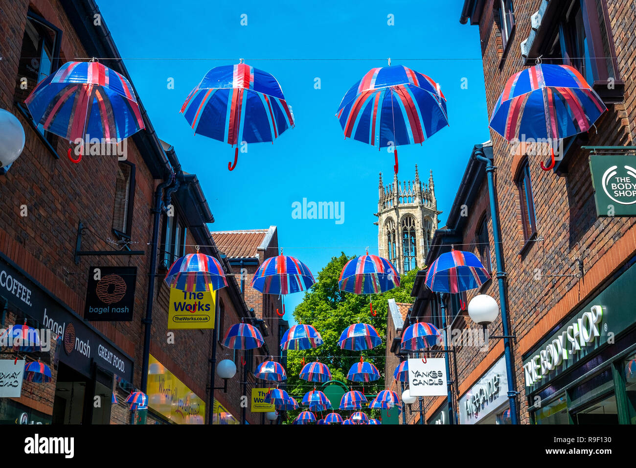 Union Jack Umbrellas hanging in a line in York street Stock Photo