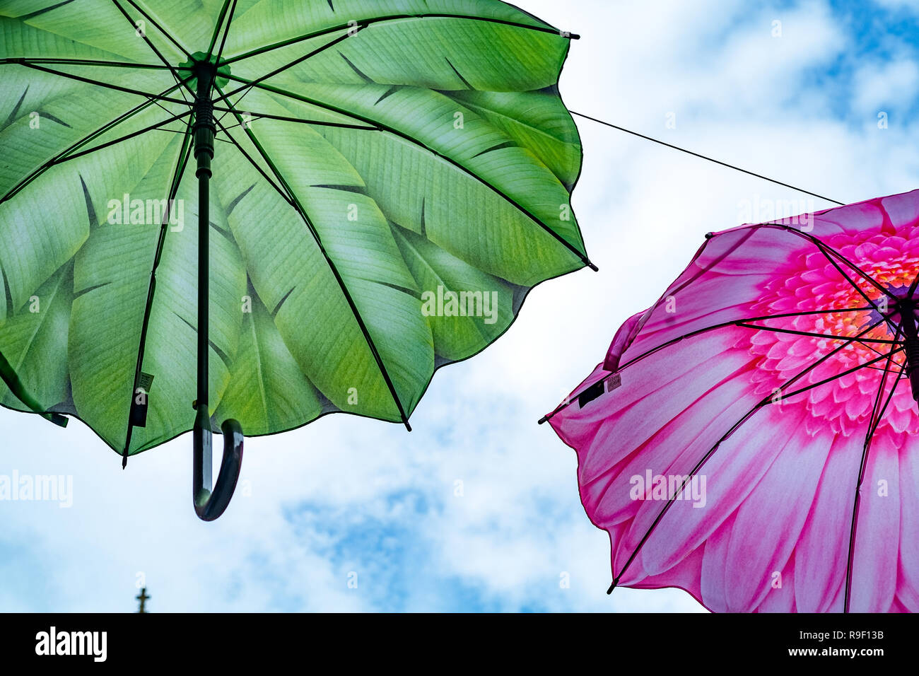 umbrellas hanging in street Stock Photo Alamy