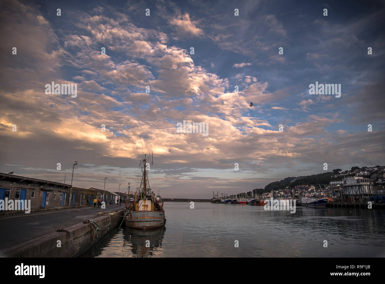 Dramatic clouds over fishing fleet Newlyn harbour Cornwall UK Stock Photo