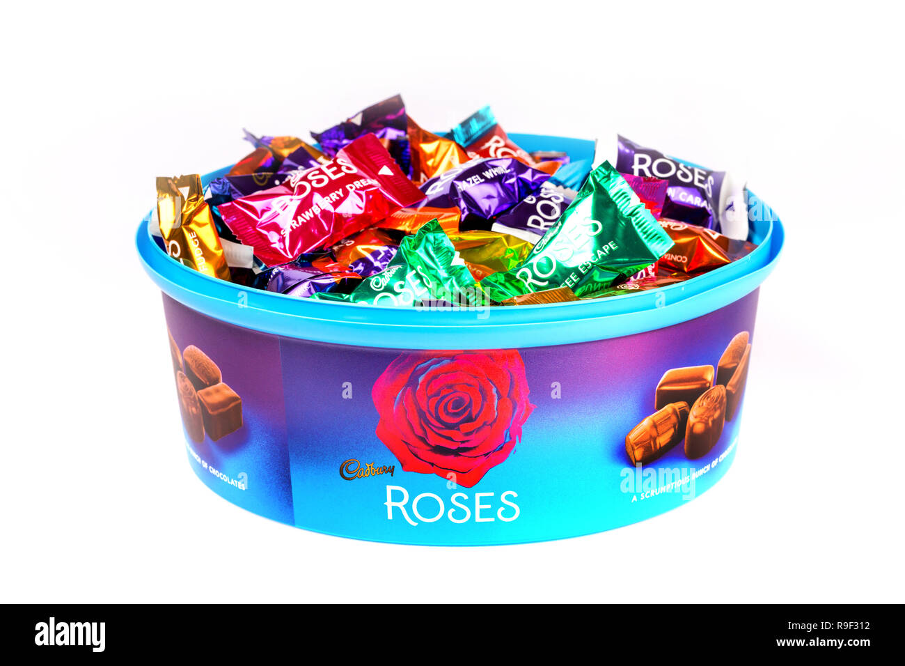 Tub of cadbury's Roses chocolates on a white background Stock Photo