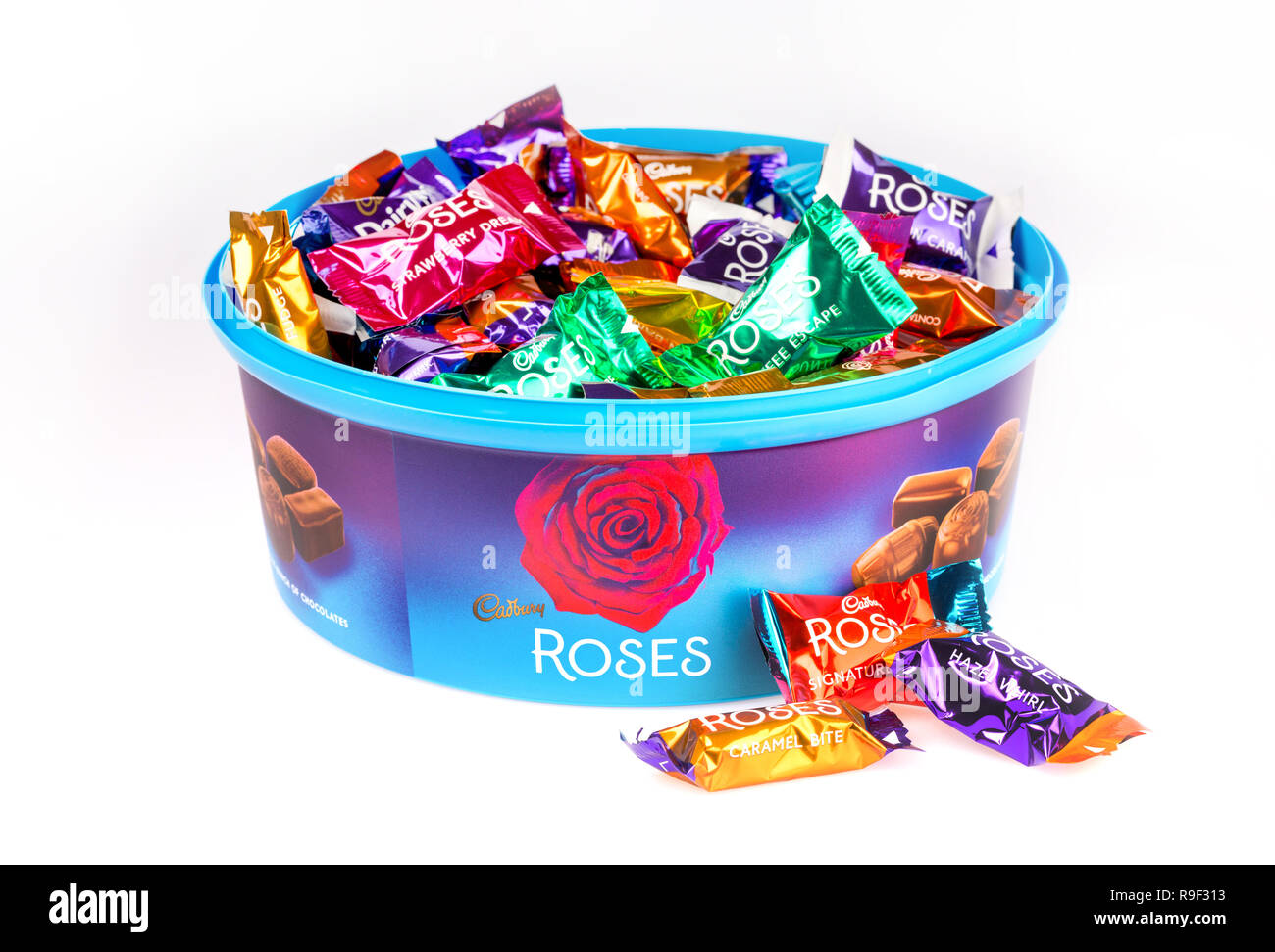 Tub of cadbury's Roses chocolates on a white background Stock Photo