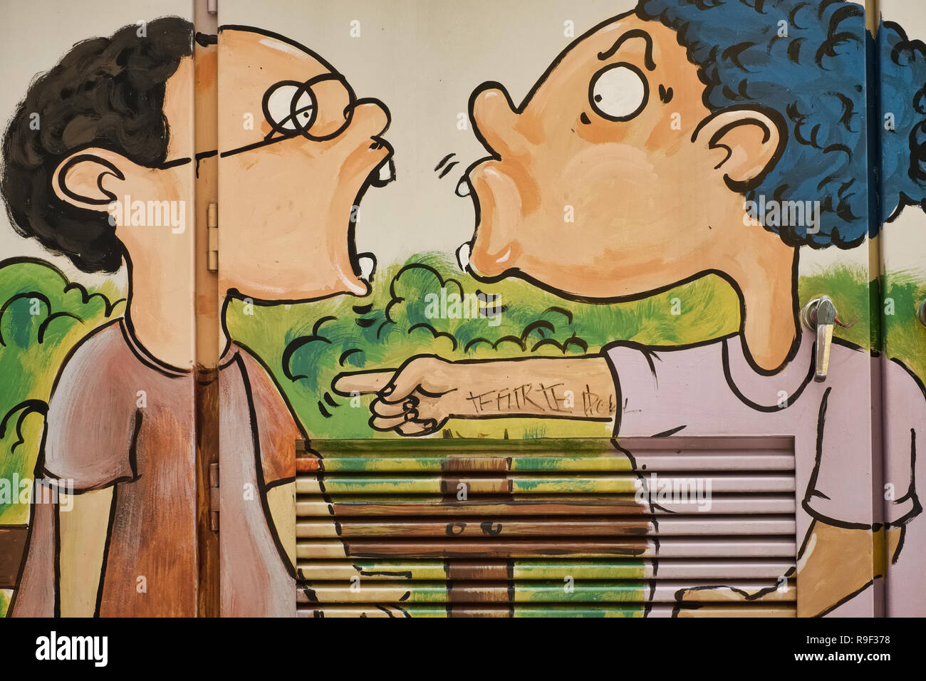 A painting applied by a student to beautify an ungainly power distributor in Bangkok, Thailand, depicting an argument or quarrel between youngsters Stock Photo