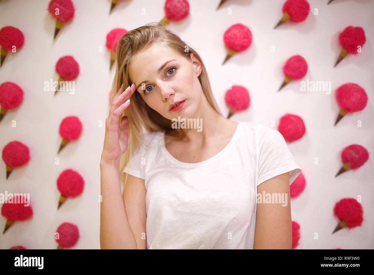 Young girl on a pink background Stock Photo - Alamy