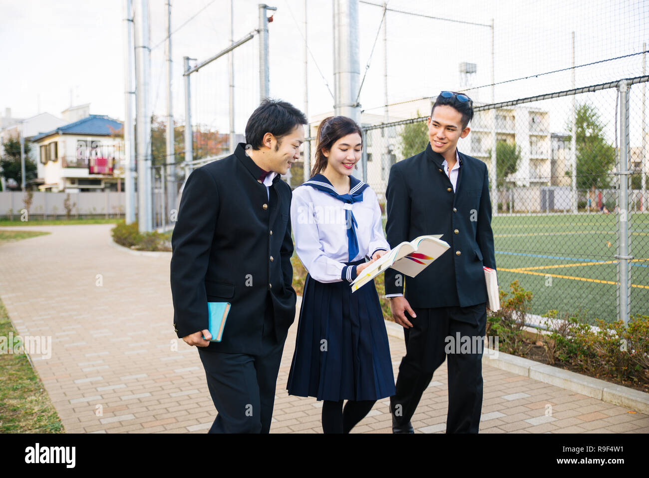 Yung japanese students with school uniform bonding outdoors - Group of ...