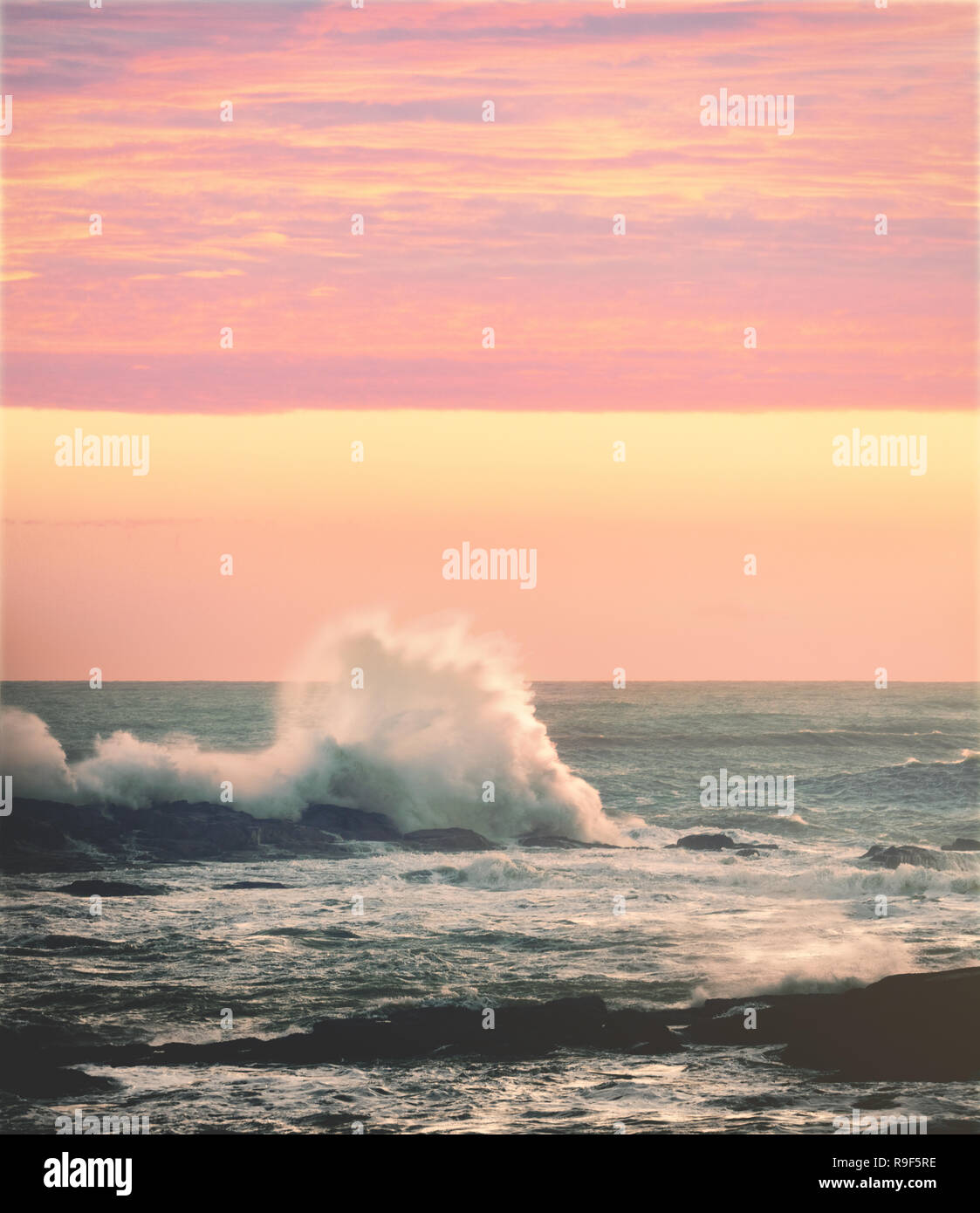 Crashing ocean waves sunset light Stock Photo