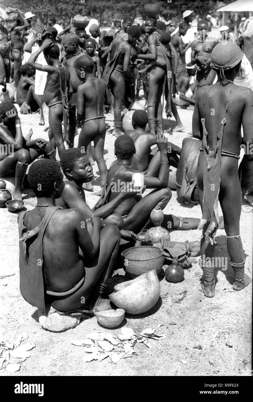 French West Africa 1950's natives gathering and queuing for food at rural market 1958 Stock Photo