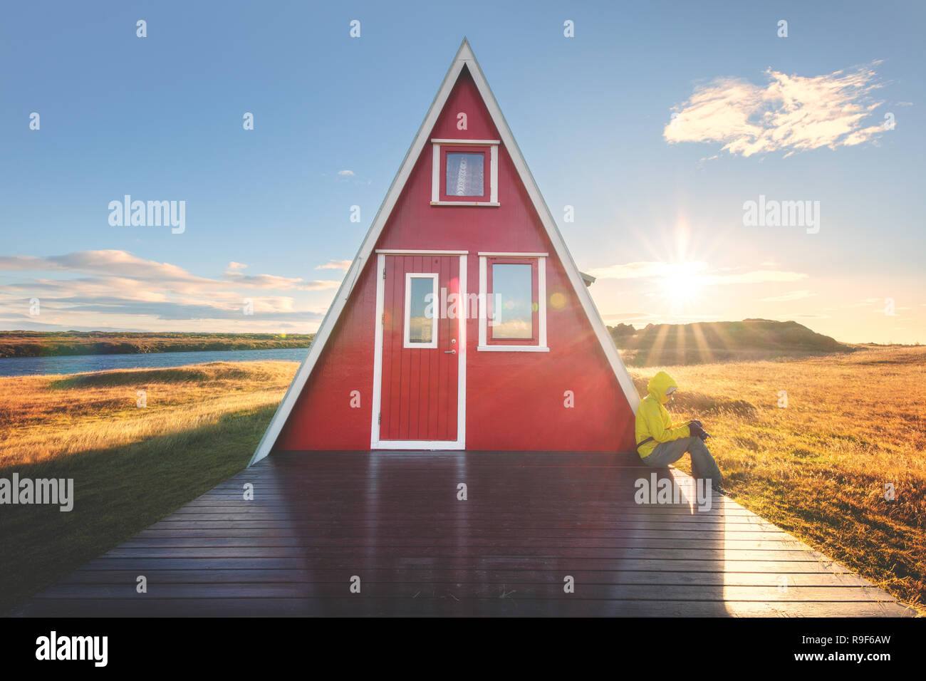Cute triangle little house cabin red Iceland Icelandic Stock Photo
