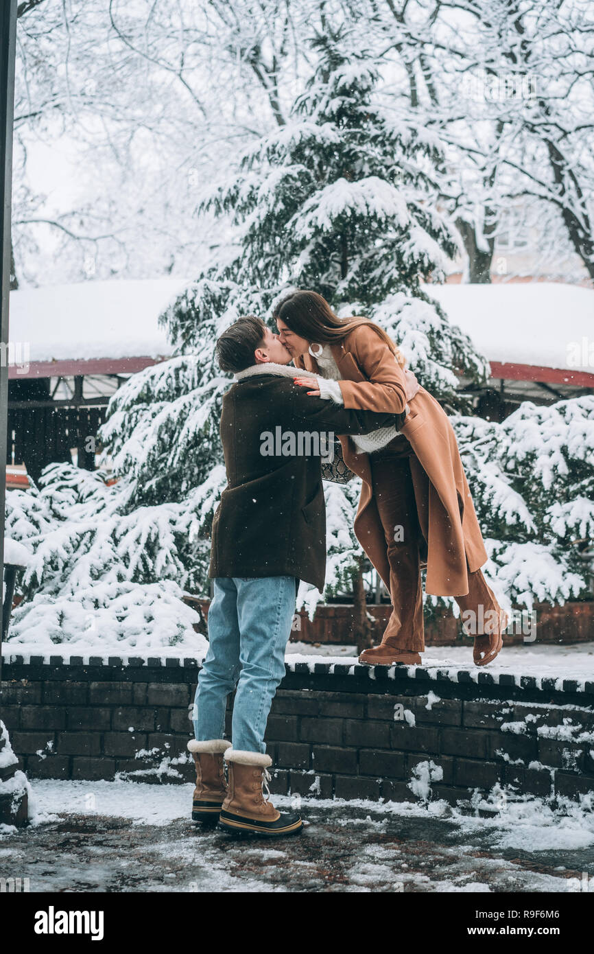 Attractive guy kissing girl hires stock photography and images Alamy