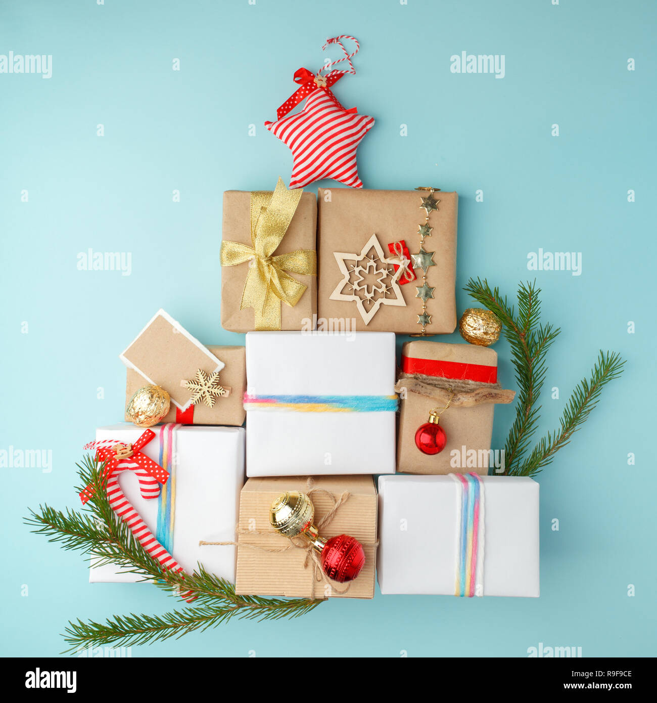 Christmas gift boxes laid out in the shape of a Christmas tree, flat lay, top view Stock Photo