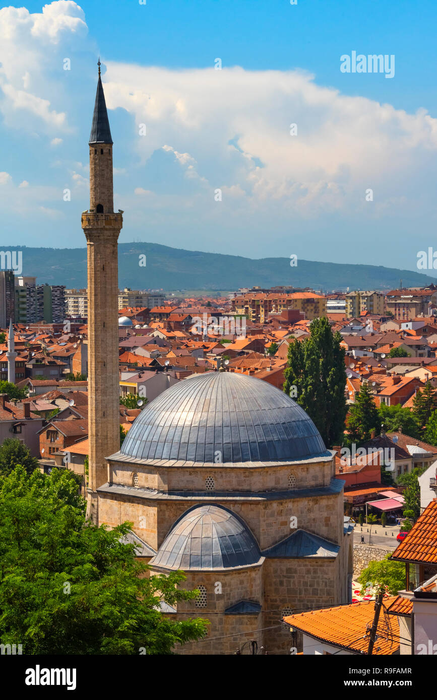 Sinan Pasha Mosque and red roof houses in the old town, new town in the distance, Prizren, Kosovo Stock Photo