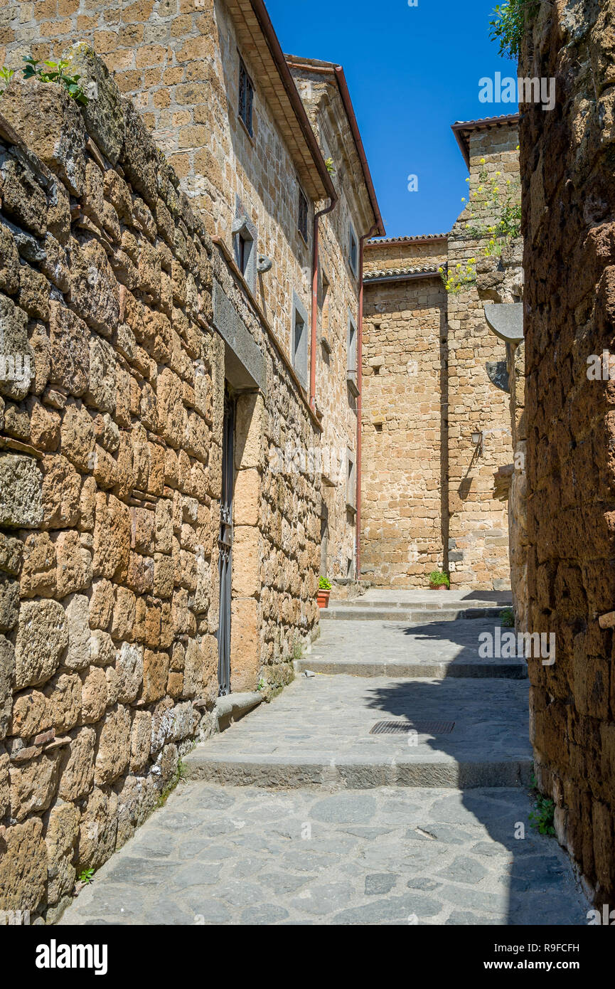 Vertica photo of Civita di Bagnoregio old town narrow street. Tuscany, Italy. Stock Photo
