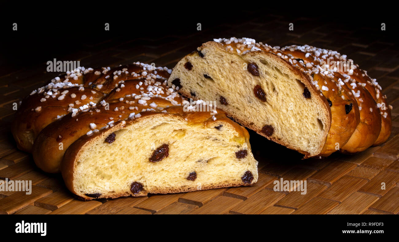 braided sweet yeast bread with raisins and sugar Stock Photo