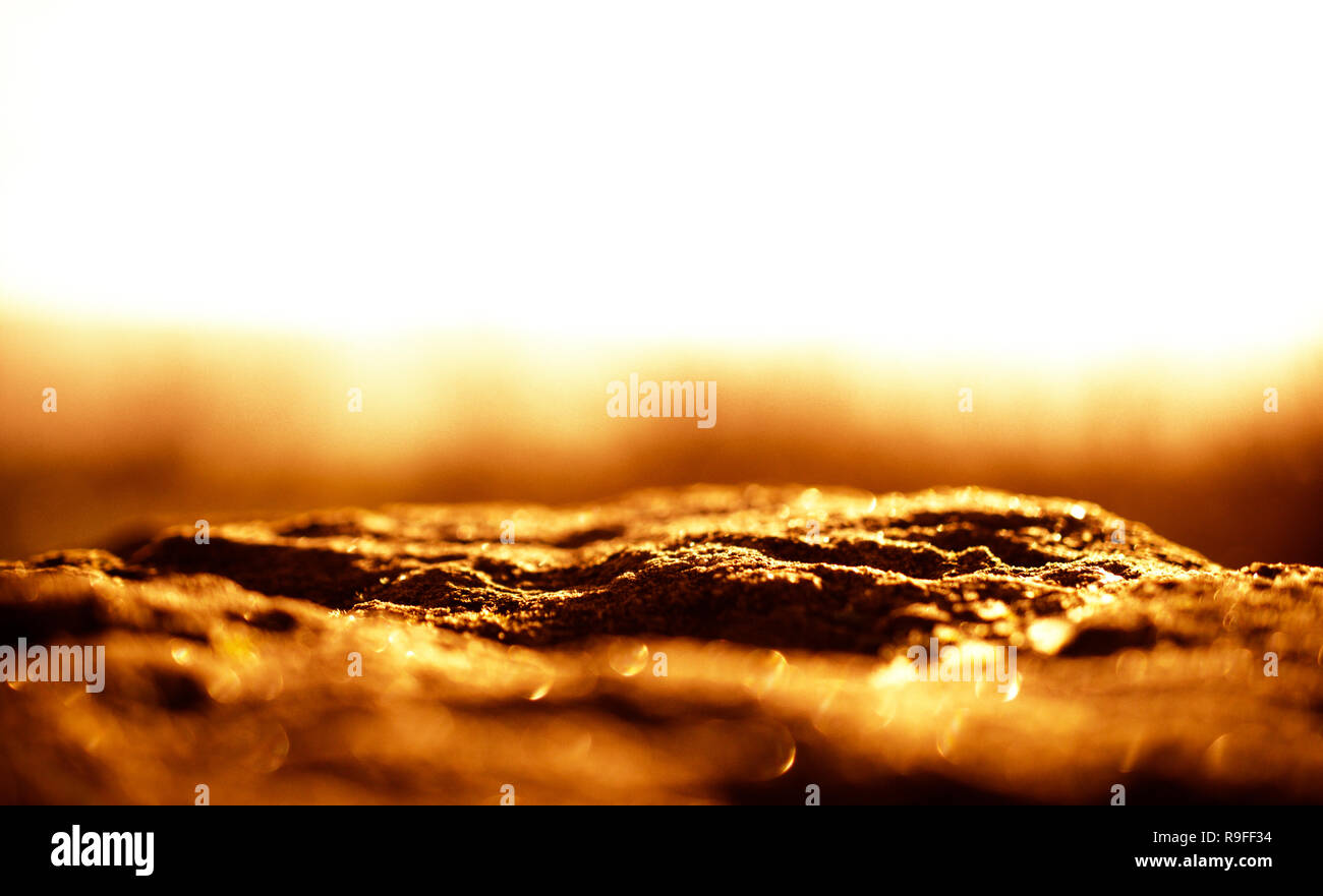 Brown rock background illuminated by the sun with free copy space Stock Photo