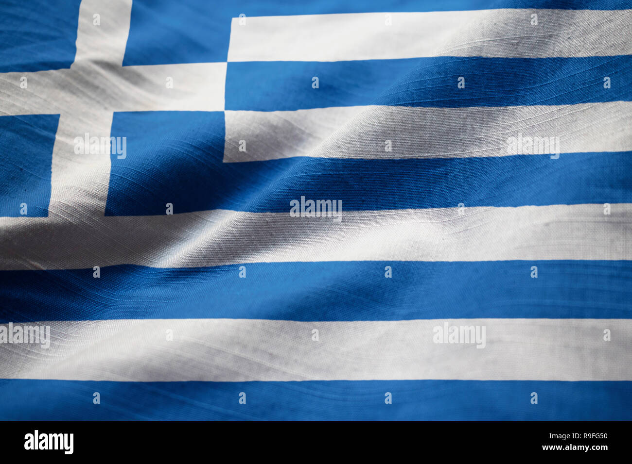 Closeup of Ruffled Greece Flag, Greece Flag Blowing in Wind Stock Photo