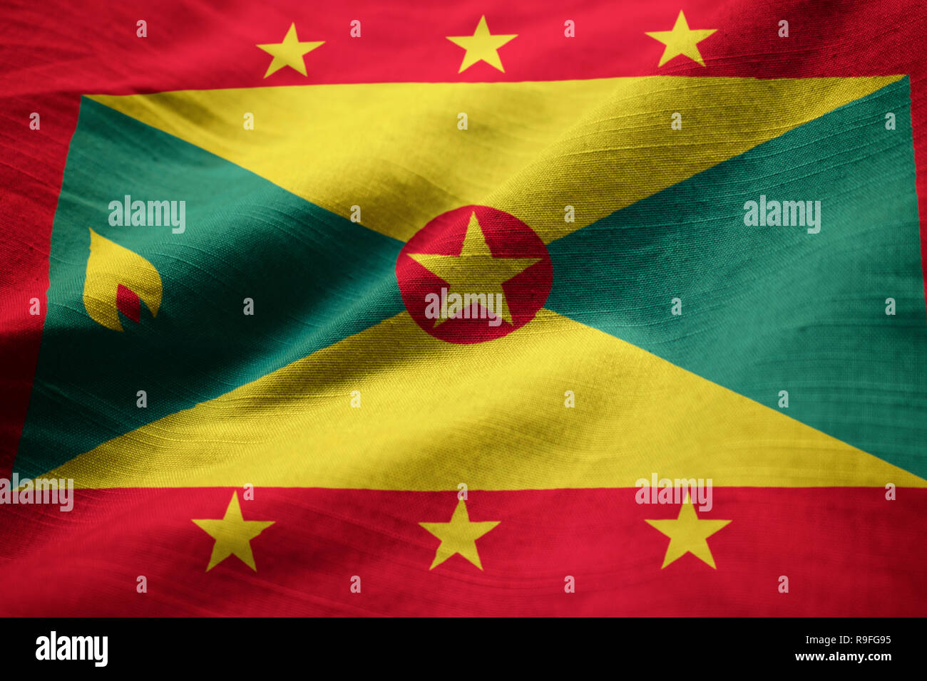Closeup of Ruffled Grenada Flag, Grenada Flag Blowing in Wind Stock Photo