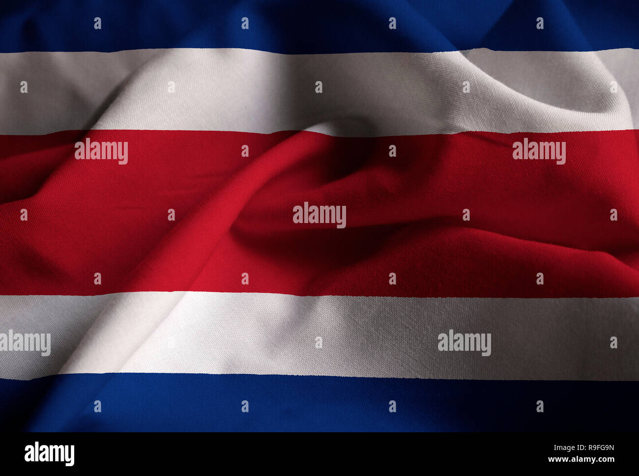Closeup of Ruffled Costa Rica Flag, Costa Rica Flag Blowing in Wind Stock Photo