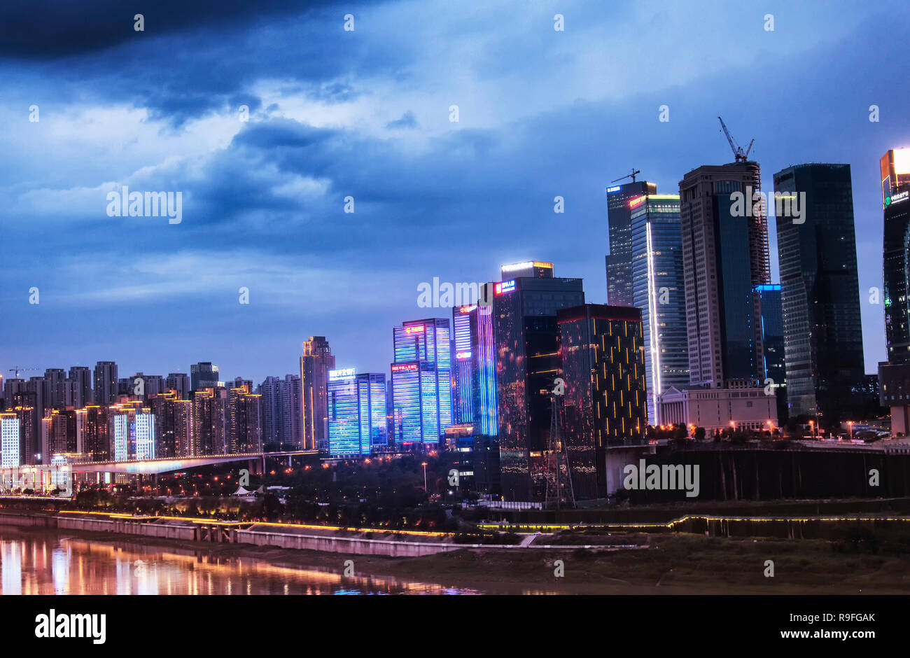 Chongqing, China. June 23, 2018. A night view of the buildings and skyscrapers near the Jialing