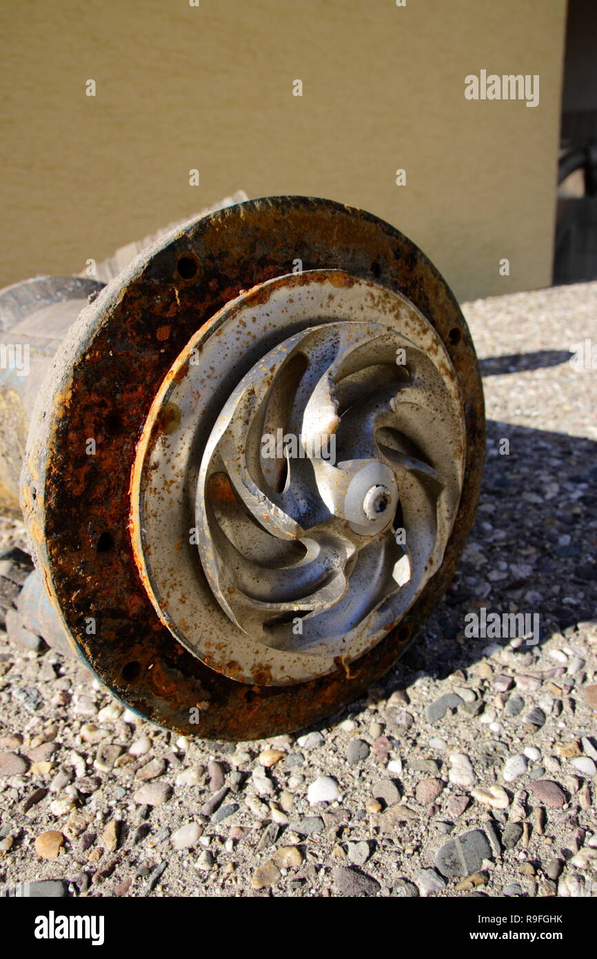 Impeller of a water pump. That impeller is heavily worn by sand Stock