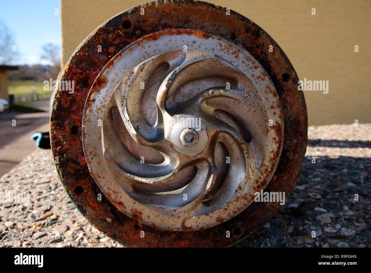 Impeller of a water pump. That impeller is heavily worn by sand Stock ...