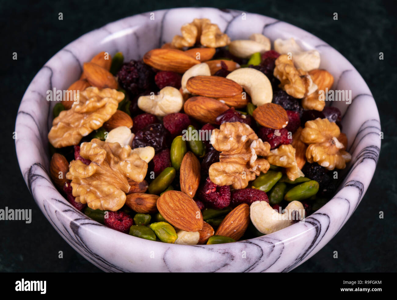Nuts mix in a marble plate Stock Photo