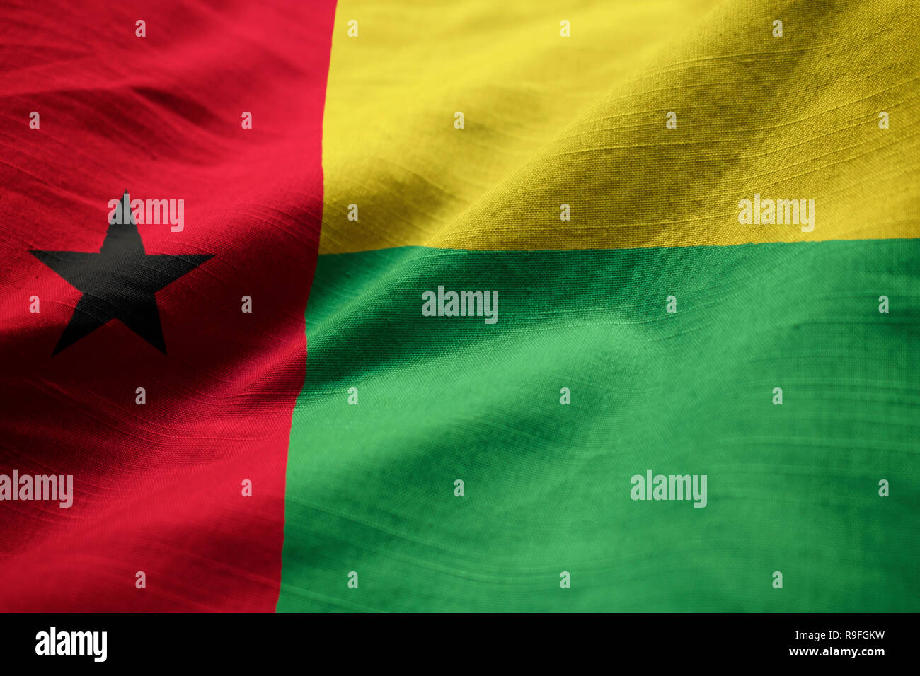 Closeup of Ruffled Guinea-Bissau Flag, Guinea-Bissau Flag Blowing in Wind Stock Photo
