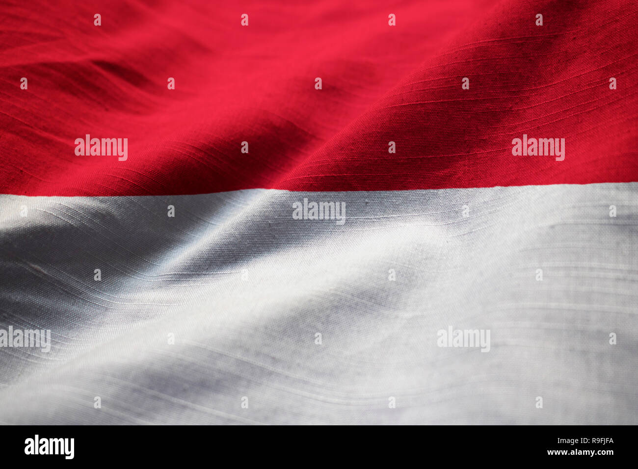 Closeup of Ruffled Indonesia Flag, Indonesia Flag Blowing in Wind Stock Photo